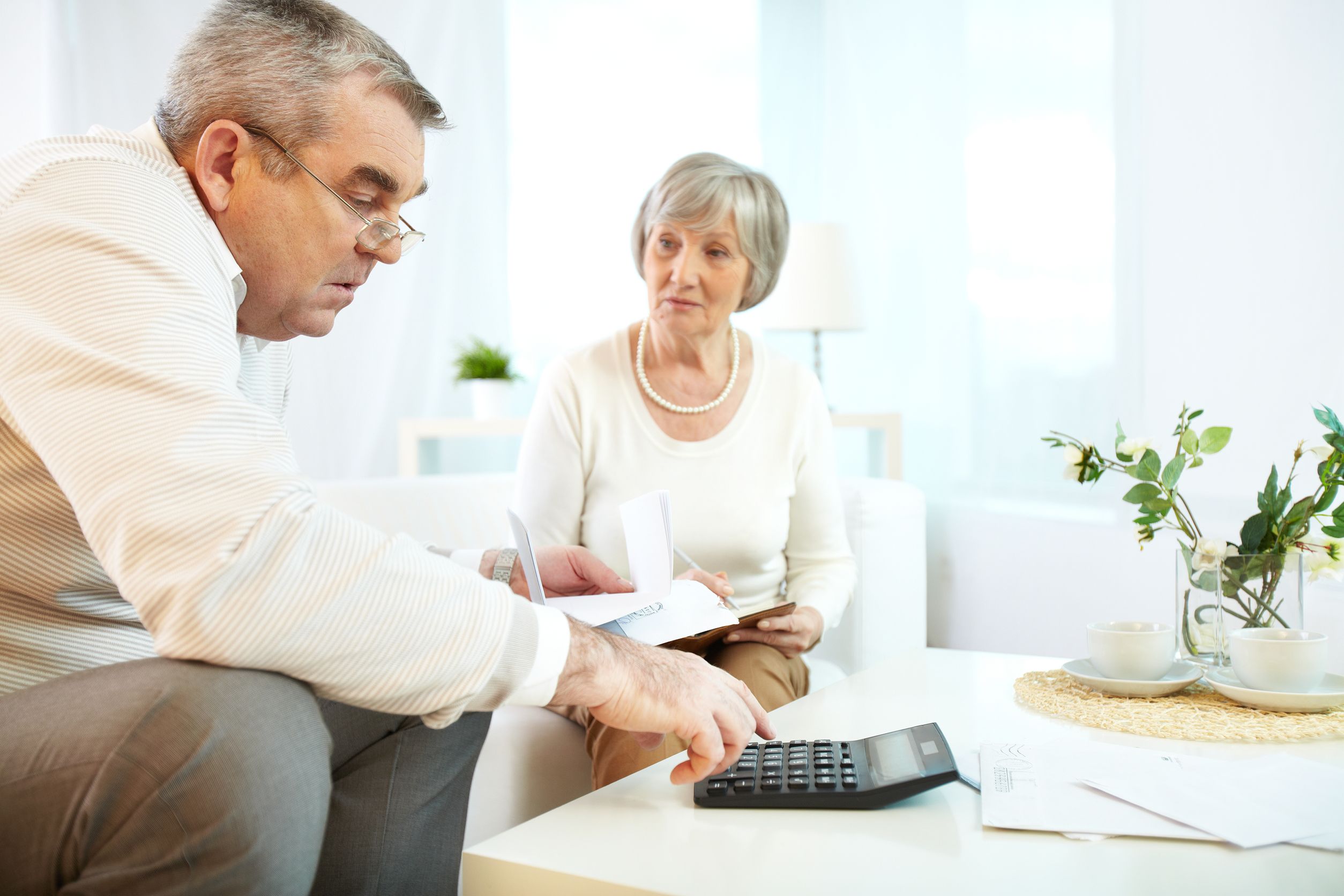 22247351_l-mature-man-and-his-wife-making-financial-revision-at-home